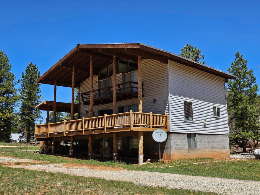 Excellent location! big lot with huge cabin, 4 beds 2 baths, bring the whole family! Enjoy the view from the massive decks and balcony. Mostly flat and usable lot with meadow grass, large pines and aspen. RV parking and dump. Connected to county water system. Solar system with 8 brand new batteries and (12) 420 watt panels High speed internet through South Central. Basement square footage is above grade and includes garage area. Seller is willing to consider seller financing with a large down payment (200k) 3.25% interest, 5 year balloon.