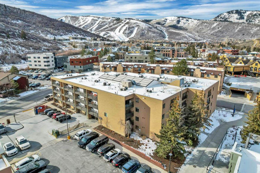 Welcome to this beautifully updated top-floor, end-unit condo in the heart of Park City-perfectly suited for both personal enjoyment and investment. This 2-bedroom, 2-bath suite is approved for nightly rentals, boasting an impressive 9.8/10 rating on VRBO with 68 reviews. Offered fully furnished/turn-key, the property comfortably sleeps up to six guests and is ready to perform from day one. Warm, rustic mountain charm blends seamlessly with modern upgrades throughout, including slate flooring, travertine tub and shower surrounds, granite countertops, and stainless steel appliances. The open-concept living area is ideal for relaxing after a day on the slopes, while the top-floor, corner location provides exceptional privacy with no neighbors above or beside, on one side. Step outside to a private top-floor balcony, offering a peaceful outdoor retreat. The primary suite features a private en-suite 3/4 bathroom, adding comfort and convenience for owners and guests alike. Enjoy year-round amenities such as underground parking and an indoor hot tub-perfect for unwinding après-ski. Located just minutes from Main Street, this condo is walkable to restaurants, shopping, and entertainment, with quick access to world-class ski resorts. Whether you're seeking a mountain retreat or a proven income-producing property, this Park City condo truly checks every box. The owner is open to transferring the existing nightly rental listing and will work one-on-one with the new owner to ensure a seamless transition and continued top-tier performance. Creative financing is available, with the owner willing to carry the note aka Seller Financing.