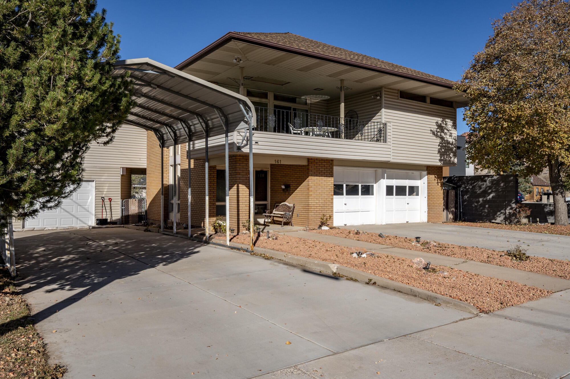 You will absolutely love this beautiful, unique, well cared for 4 bedroom, 2 bath, multi family home with 2 separate large garages, carport, and spacious art studio in the garden. Enjoy the mountain view from your second-floor kitchen and living room, and a spacious covered balcony with a view of the 'C' overlook. The second story of the home offers a living space that includes three spacious and comfortable bedrooms, a fireplace in the living room, and a second fireplace in the uniquely large entertainment room. The full kitchen is well-equipped, making it perfect for family meals and entertaining guests. There is also a full bathroom serving the upper level and a separate vanity area in the master bedroom. Additionally, the upstairs unit includes its own two-car garage along with extra parking spaces. For those who prefer a hassle-free transition, furnishings can be included. The first-floor apartment with a separate entrance is equipped with its own bathroom, full kitchen, and a walk-in closet with modern washer and dryer. The apartment also includes a private large garage and additional carport/RV parking. It is the ideal space for independent living, rental opportunities, or in-law suites. The art studio in the backyard is fully insulated and equipped with existing electricity and wiring for 220V. In addition to the spacious art studio, the outdoor space holds two storage sheds, mature cherry and apricot trees, and is well suited for gardening or outdoor activities. Furthermore, the infrastructure of the home has been updated, featuring a new electrical box installed just four years ago.
This property is an exceptional opportunity for those seeking a flexible living arrangement with plenty of space and amenities. Don't miss the chance to own this unique multi-family home!