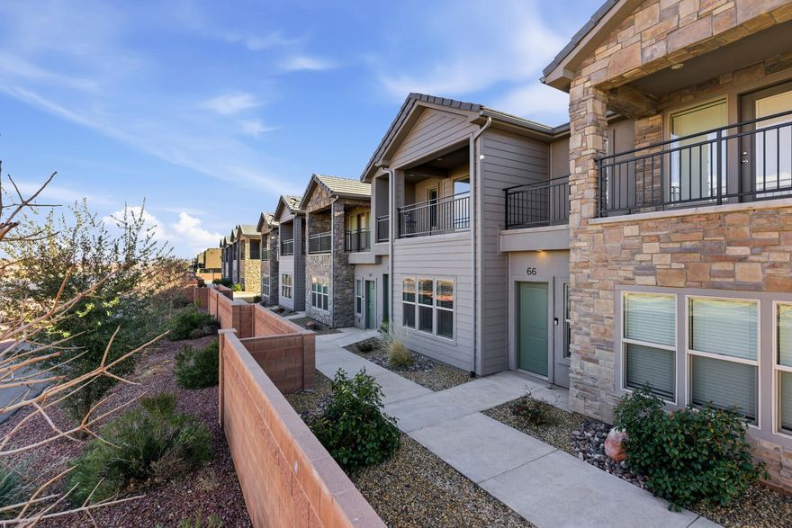 Rare townhome in the coveted Azalea community with gorgeous red rock views! This like new home has been meticulously maintained and gently used. Elevated finishes include quartz countertops, 42'' upper cabinets, and upgraded LVP. Featuring a bright, open floorplan and 3 spacious bedrooms. Garage includes an EV charger. Spend the day in Snow Canyon, and when you return, soak in the pool and hot tub. Relax on the private balcony and take in stunning red rock, pine valley, and sunset views to close out the night. Enjoy convenient proximity to renowned hiking and biking trails, Snow Canyon State Park, Zion National Park, and much more!