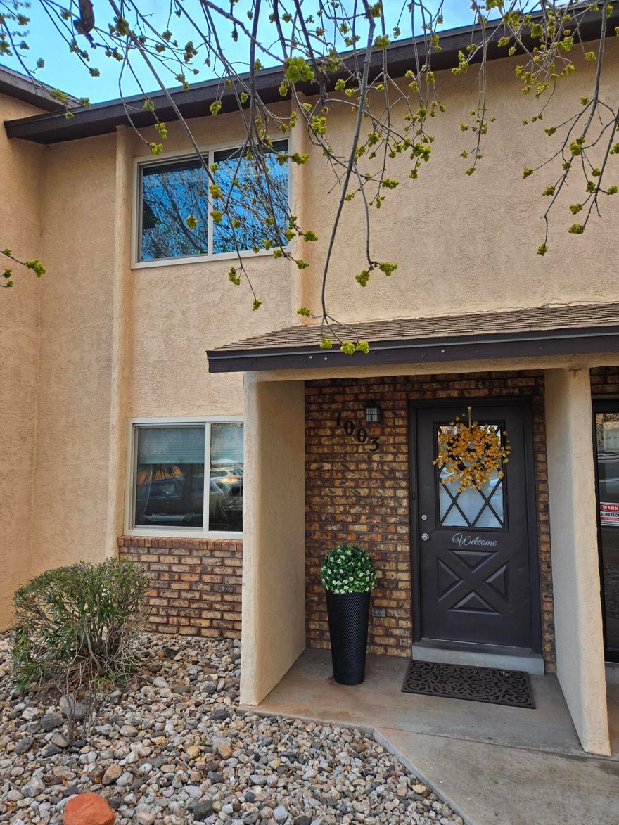 Fully renovated 2BR/1.5BA townhome -- out with the old and then rebuilt with quality updates throughout! Recent improvements include new roof, new windows, fresh interior paint, new carpet and tile, completely replaced and re-designed kitchen with new cabinets and countertops and all new appliances new toilets, and modern light fixtures. Cozy living area features a newly added fireplace. Move-in ready with major lifting already done -- perfect for homeowners or investors alike! Located close to shopping and restaurants this really is an amazing location. Come Enjoy the community pool and see what this amazing home has to offer.