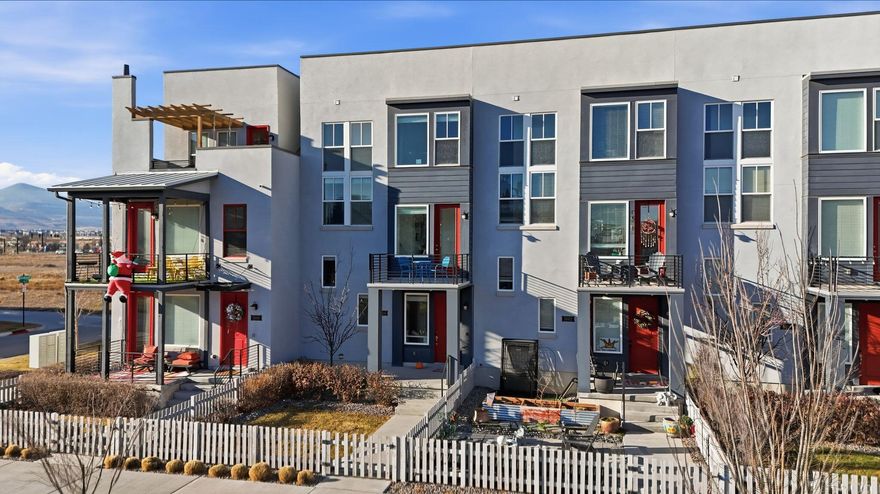 Modern townhome living offering great space and fantastic views! Enjoy an open concept floor plan with spacious living area that flows into the kitchen and dining. The kitchen offers crisp white cabinetry, stainless appliances and large island. The primary suite includes an ensuite bath with walk in shower. Additional bedrooms are well sized and versatile for guest, home office or fitness space. Enjoy two private balconies and a 2 car garage for added storage. Conveniently located near shopping, dining, TRAX and the new Bee's Baseball Stadium.