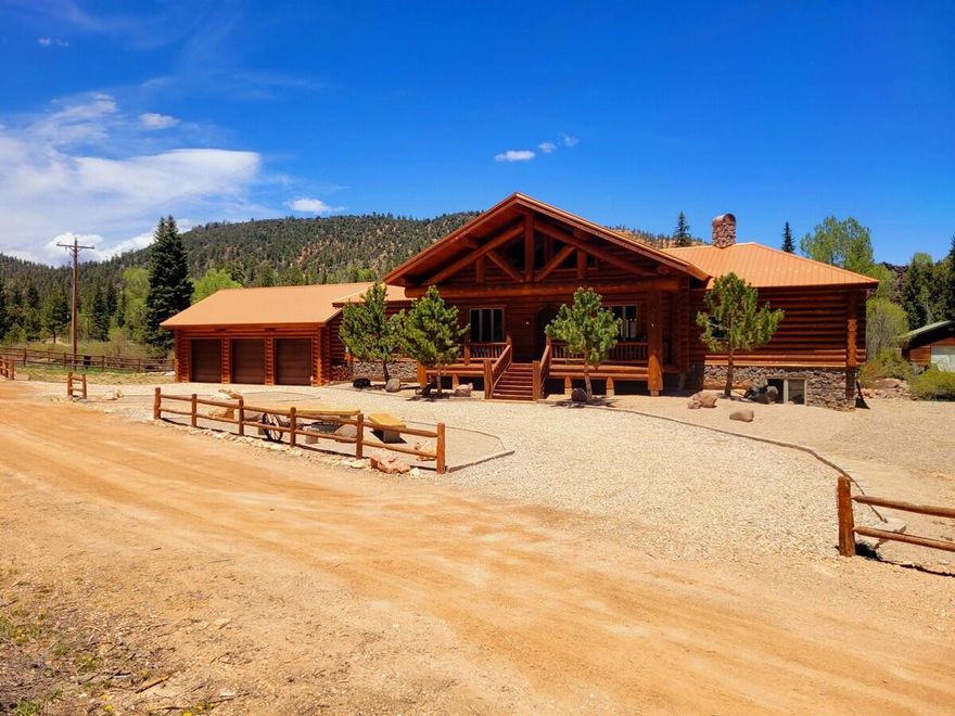Open the windows and enjoy the beautiful sounds of Mammoth Creek. This 4943 sq ft custom log home sits on 2 lots boarding Mammoth Creek. The majestic home has 12'' logs on the outside and 22'' log trusses on the inside. The home includes 5 bedrooms, 3.5 baths, great room, gourmet kitchen, theater room, game room, and detached 3 car garage. The cabin is loaded with top-of-the-line upgrades throughout including custom cabinets, granite counter-tops, solid copper sinks, Siberian pine distressed wood floors, slate, and carpet. The Casement Windows are wrapped with authentic half-log and trimmed with granite window sills. The living area is open and inviting to all that come through the front door. Everyone will enjoy the wall of windows and decks that overlooks the Mammoth Creek.