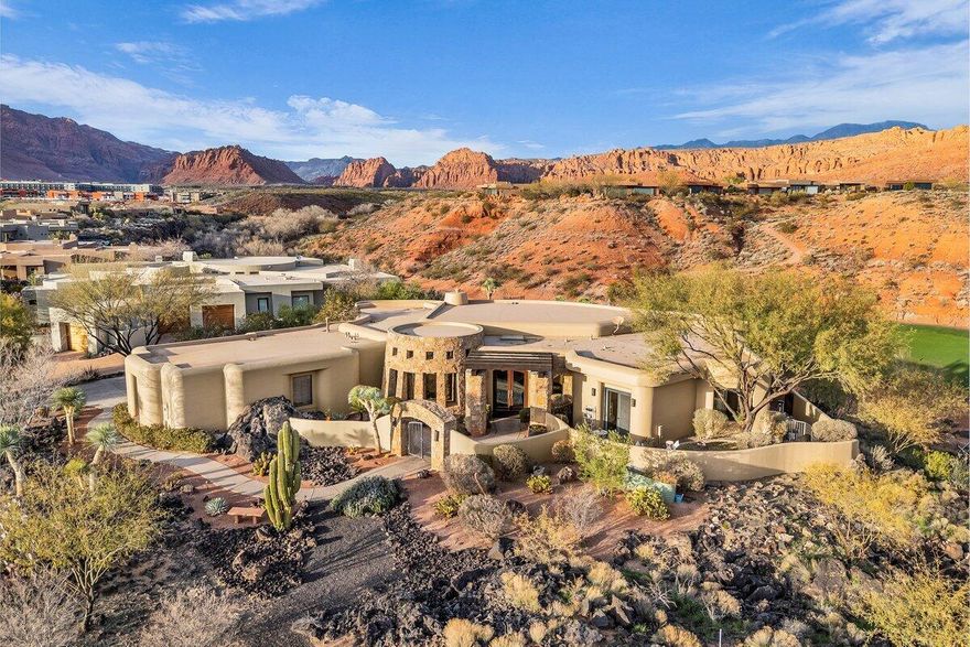 Perched high above the 18th green at Entrada Country Club, this immaculate home features unobstructed views of Snow Canyon State Park and Kachina Cliffs on absolutely one of the finest lots in all of Entrada. The desert oasis is complete with a private pool & spa, fire and water features, two fireplaces, and solid wood doors. The grand great room includes a gourmet kitchen with spacious walk-in pantry. All furnishings are included with a few exceptions. Entrada is southern Utah's premier gated golf course community. The lifestyle includes a restaurant, clubhouse, and community events. The clubhouse includes two pools, fitness center with a  variety of daily classes, spa, pickleball, tennis and volleyball.
