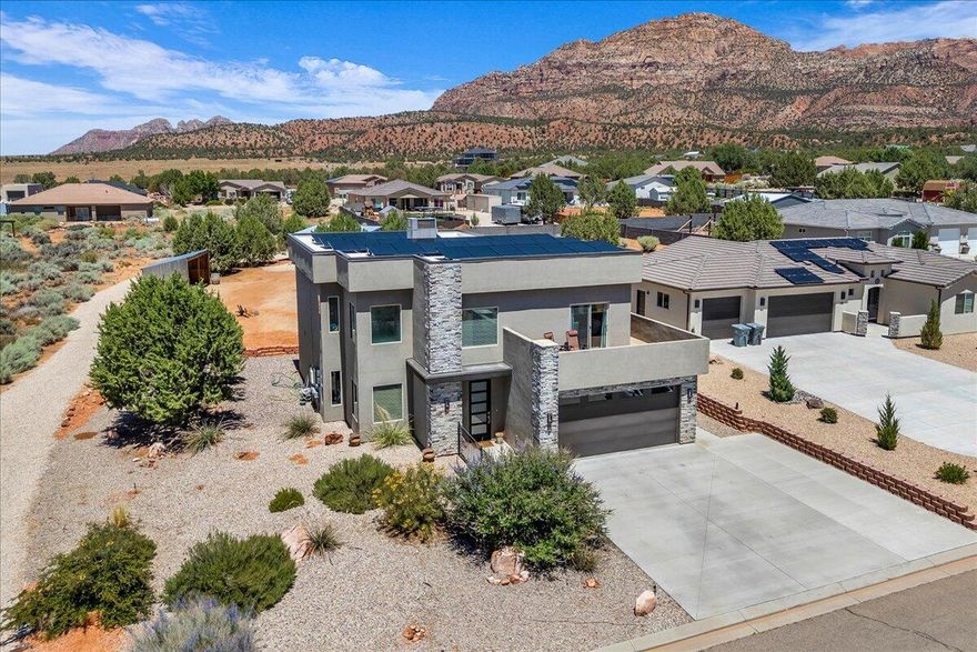 This stunning property boasts majestic views of Red Mountains, plateaus and vistas, perfectly capturing the natural beauty of the surrounding desert landscape. Modern design and finishes throughout. Two private decks offer the perfect vantage points to take in breathtaking views. Inside, the home features quartz countertops, ceiling fans, and plank style tile, adding to the charm. A detached casita built in 2023 provides additional living space complete with a kitchenette, bedroom, bath. Offering flexibility and versatility. The natural beauty of the desert surroundings creates a serene and peaceful atmosphere.