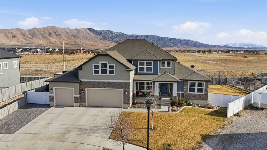 Located in the highly desirable Brandon Park community of Eagle Mountain, this beautiful home offers country-style setting while remaining just minutes from shopping, schools and everyday conveniences-with no HOA. The open main living area features soaring vaulted ceilings and impressive floor to ceiling windows that fill the space with natural light. A spacious kitchen includes a large island, quartz countertops, upgraded appliances and plenty of storage. The finished basement offers flexibility with a mother in law apartment with separate entrance, complete with kitchen, living room, laundry, bedroom and bath. Perfect for multigenerational living or guests. A sixth bedroom is already framed, allowing for easy expansion. Enjoy the fantastic backyard with pergola and lush landscaping along with RV parking on the side.