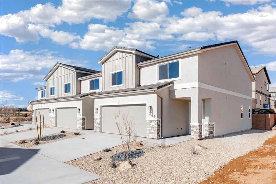Welcome to this brand-new 4-bedroom, 2.5-bath townhome in the heart of Hurricane, Utah, offering 2,346 sq ft of beautifully designed living space. Thoughtfully upgraded throughout, this home features granite countertops, engineered wood flooring, and tile showers and baths that bring both style and durability together. The open-concept layout is perfect for entertaining or everyday living, while the large bedrooms provide comfort and flexibility for family, guests, or a home office. Enjoy the convenience of a full-size 2-car garage and low-maintenance living with HOA dues of just $100 per month. Ideally located near outdoor adventure, you're just minutes from world-class hiking, biking, and sightseeing at Zion National Park, with easy access to local shopping, dining, and schools. Whether you're looking for a primary residence, second home, or investment property, this move-in-ready townhome delivers modern finishes, generous space, and an unbeatable Southern Utah lifestyle.