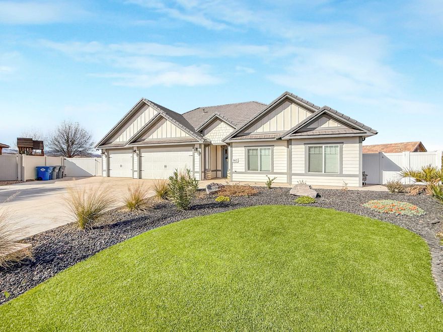 Built with high-quality materials and excellent craftsmanship, this clean and charming property features an extra-large garage and spacious RV parking, offering ample parking and storage. The fully fenced in yard is designed for low maintenance, and low water use. You'll also enjoy stunning red rock views from the extra large covered patio. Large lot that could accommodate pool or other improvements. No HoA.