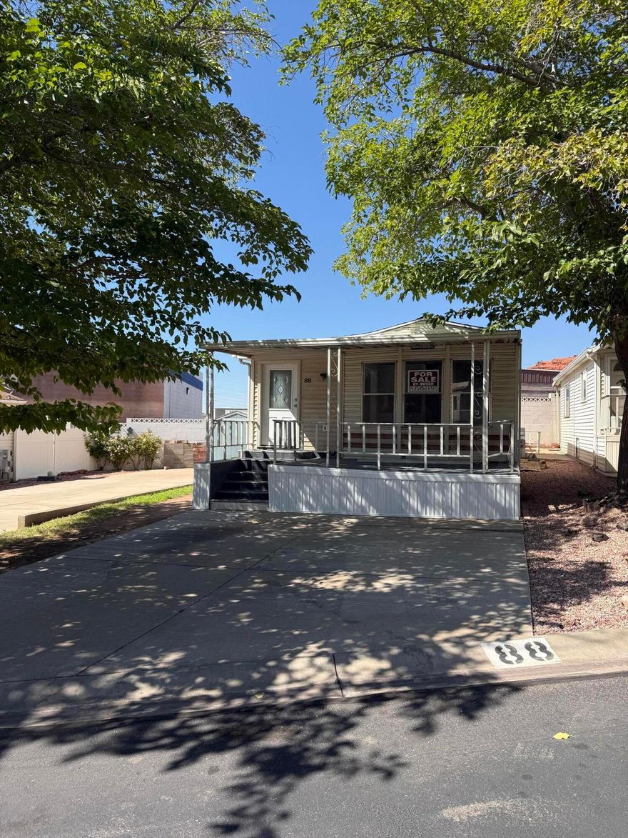 Welcome to your new oasis in this amazing 55+ community. This home was recently updated with new flooring,  paint, along with new plumbing and a new roof.  This home has access to a pool, work out center and has the perfect blend of comfort, style, and convenience. This lovely manufactured home is located close to golfing, hiking, shopping, and easy access to I15. and Zion National Park, Snow Canyon and Sand Hollow resort to name a few of the close fun attractions. Schedule your private tour today and experience all that this home and community have to offer