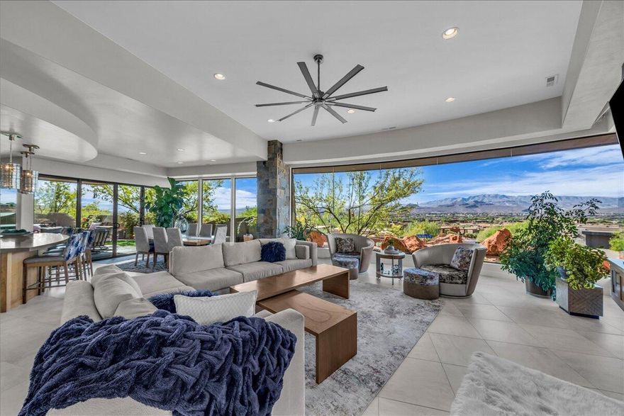 TURN-KEY LUXURY HOME WITH GOLF MEMBERSHIP AVAILABLE... NO WAITING LIST!!  
This Parade of Homes residence showcases stunning red rock views and unforgettable sunsets, framed by dramatic walls of glass that bring the outdoors into everyday living. Located in the prestigious Vistas of Entrada, this contemporary home is thoughtfully designed and beautifully finished with designer features throughout.

The gourmet kitchen is a showstopper, featuring rich walnut cabinetry, a Sub-Zero refrigerator, Wolf appliances, a Miele dishwasher, and a hidden pantry—perfect for both entertaining and daily living. Custom designer furnishings are available for purchase, offering a truly move-in-ready experience.

Recent updates include new built-in bookshelves in the office, along with new flooring in both the office and the primary bedroom.