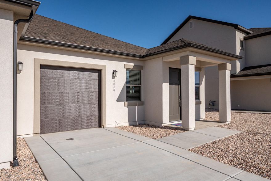 Just completed twin home, new construction offering 993 sq. ft. of efficient, modern living with a thoughtfully designed open floor plan. The kitchen and great room connect seamlessly, creating a bright and functional space for everyday living. Upgraded finishes and contemporary fixtures add a polished, modern feel throughout. The primary suite includes an attached bath, while a second bedroom and full bath provide flexibility for guests, workspace, or hobbies. Fully landscaped yard, covered patio, and attached one-car garage complete the home. A low-maintenance, move-in-ready option with modern design in a growing neighborhood.