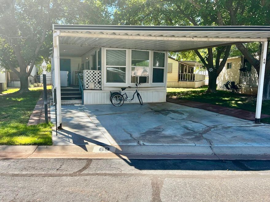 This spacious Park Model home is move-in ready and uniquely furnished. The home sits on a rented lot with a monthly rent of $550, which includes the HOA fees. The home offers newer updates, including newer flooring throughout, a newer water heater, newer furnace, newer refrigerator, and newer front windows. A great covered deck provides the perfect spot to relax, and there's even a separate laundry room/office for added convenience. Enjoy a comfortable, low-maintenance lifestyle in a welcoming community with these thoughtful upgrades already in place. Buyer to verify all information.