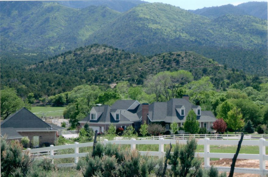 Welcome to this one-of-a-kind luxury estate in New Harmony, at the foot of the majestic Pine Valley Mountains.  (See video) This custom masterpiece spans over 7555 square feet of living space, offering 5 bedrooms, 6 baths, formal living and dining areas, 3 fireplaces, master bedroom on the main level and the view of Ash Creek from your picture living room window. The kitchen is equipped with Wolf and Sub-Zero appliances, as well as a Scotsman pebble icemaker. Full sized pantry and food storage area, including a double washer dryer laundry room.  Enjoy indoor-outdoor living and from one of several decks and patios.  Every detail of this home has been meticulously crafted Fine interior upgrades and furnishings adorn every corner, with themed bedrooms adding a touch of personality .. and charm to the living spaces.  Built in 1995, but completely remodeled in 2007. Furnishings included (see included & excluded list).
A circular driveway welcomes you to the grandeur of the property, while a gated private drive ensures exclusivity and privacy. Nestled on meticulously manicured grounds spanning over 13 acres and adorned with a picturesque pond and fountain, 1960 sq. ft. barn and pasture, garden and shed, and fully fenced, sprinkled and mature landscaping.  The property has security cameras and custom Christmas lights! The estate includes a private well with 20 acre-feet of water rights.  Furthermore, this estate offers animal rights, allowing for the keeping of livestock or horses, catering to equestrian enthusiasts or those seeking a rural lifestyle. 
Enjoy recreational activities with a tennis/pickleball court on the property, as well as a pool and pool house.  The pool house has a complete gym, sauna, massage room, laundry room, and full kitchen. Additionally, an outdoor kitchen further enhances the outdoor living experience, allowing for seamless alfresco dining amidst the stunning surroundings.  PLEASE SEE LIST OF INCLUDED AND EXCLUDED ITEMS under Documents.
The estate offers unparalleled views of the surrounding mountains, valley, and the iconic Kolob Mountains of Zion National Park.
Whether as a primary residence or a tranquil retreat, this incomparable estate offers a rare opportunity to own a piece of paradise in one of Utah's most coveted locations.