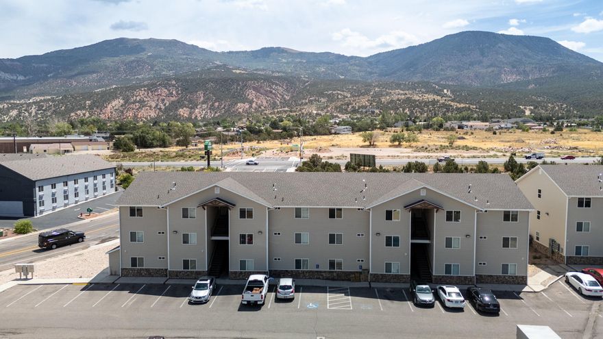 Rare opportunity for an established 24 unit student apartment building in the middle of Cedar City! The property consists of two 12 plex apartment buildings that are each 3 stories tall, making up 96 bedrooms in total. Each apartment unit floor plan consists of 4 bed 2.5 bath with it's own kitchen, living room/dining area & laundry. Newly built in 2018, the apartment building and units are in great shape. As a student rental, the building has been receiving around $550 per month per private bedroom. The landlord is currently paying all of the utilities. Plenty of parking with 125 parking stalls. With being around 1 mile from the SUU campus, this building is ideal to be used as a student housing complex. SUU is projected to continue to grow. Don't delay, come see today!