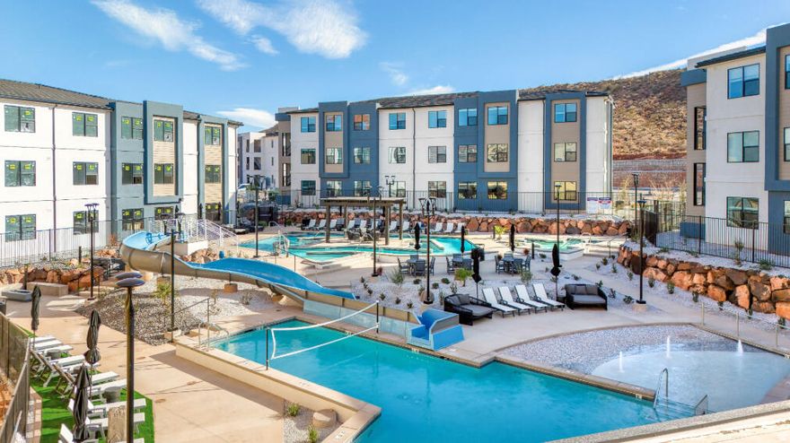 Designed for adventure and relaxation, this spacious 5-bedroom, 5-bathroom condo in Terra's Loft building offers the perfect home base for your Southern Utah escape. Spread across three stories, this thoughtfully crafted home features open living spaces, modern finishes, and a private rooftop deck with a hot tub-ideal for unwinding after a day of exploring. Enjoy access to resort-style amenities, including a pool, waterslide, lazy river, and pickleball courts, or venture out to Zion National Park, Sand Hollow, and Quail Creek. Whether you're making memories with family or friends, this condo is built for fun and convenience.