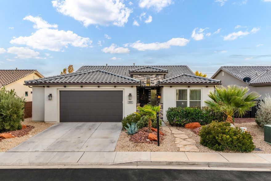 Welcome home to BRIO! Experience RESORT-STYLE living in one of the area's most sought-after communities-where over 300 days of sunshine meet easy living, endless activities, and modern comfort. This beautifully maintained 4-BEDROOM, 3-FULL BATH home is thoughtfully designed with a bright, open floor plan and soaring vaulted ceilings that create a spacious, inviting feel. The open kitchen shines with sleek quartz countertops, an upgraded appliance package, and expansive wood floors flowing seamlessly through the main living areas. You'll love the home's modern, clean design, abundant natural light, and rare EXTRA-LARGE garage-perfect for storage, hobbies, or outdoor gear. Situated on an elevated lot, this home offers scenic views and a sense of privacy above the surrounding properties. Enjoy all that Brio has to offer: indoor and outdoor pools, pickleball and tennis courts, scenic trails, a state-of-the-art fitness center, and one of the most STUNNING CLUBHOUSES around. Homes like this don't come up often-so don't miss your chance to make Brio your next home or desert retreat!