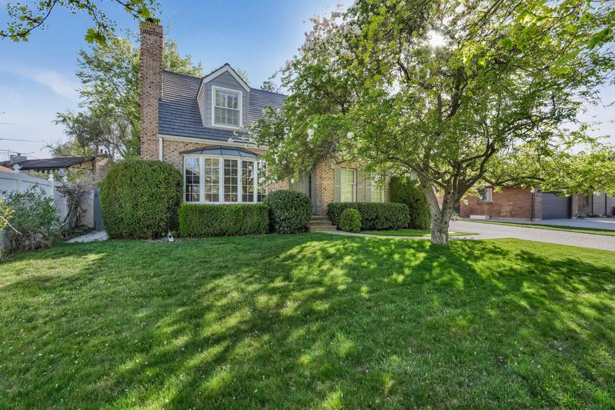 This beautiful crafted home is rich in charm and character, offering timeless details and luxurious finishes throughout. Located in desirable neighborhood of Holladay, it combines upscale living with an unbeatable setting. Thoughtful design features include wood floors throughout, crown molding in the living and dining rooms, copper-roofed bay and bow windows, durable Owens Corning slate roof. The gourmet kitchen is equipped with 2 Wolf ovens, sub zero refrigerator, granite countertop and plenty of storage space. Stone flooring enhances the main and upper level bathrooms, and double laundry rooms add convenience. Enjoy year round relaxation in the sunroom with its spa, limestone floor, and bamboo ceiling. The private backyard boasts a sparkling swimming pool, brick pool deck, spacious deck and upper level balcony overlooking the pool. Recent updates include new furnace, adding to the homes comfort and efficiency.