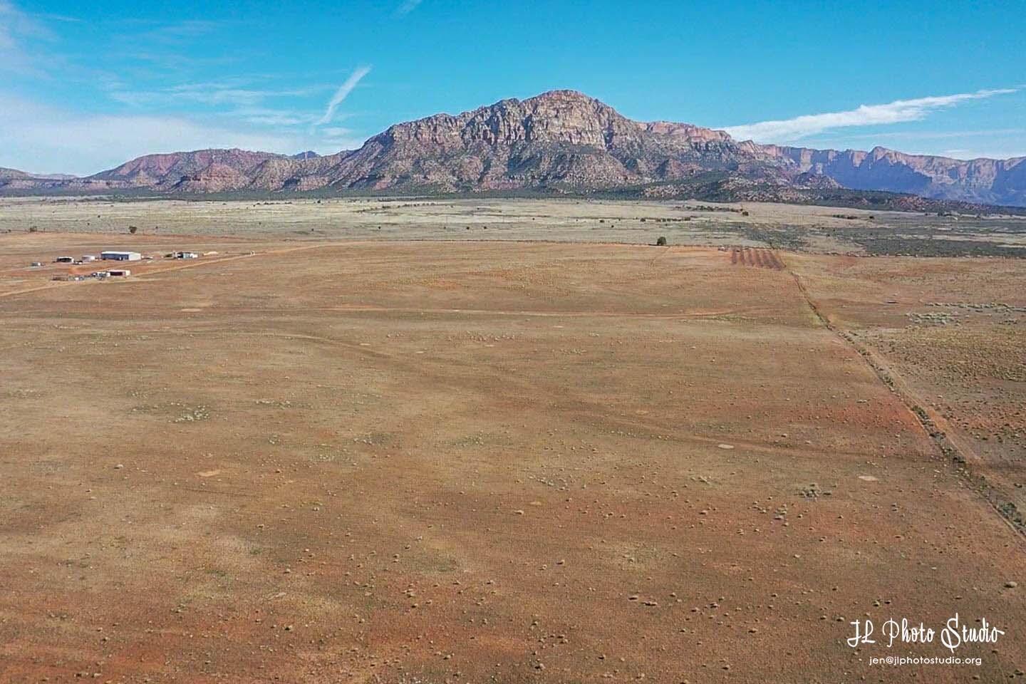 Beautiful lot in Apple Valley. The views of Smithsonian Butte, Canaan Mtn. and Zion National Park are spectacular to say the least. Lots of elbow room around these lots, build your estate, mini ranch and your dream home. Currently there are no city water lines on Coyote Road. Includes 1 acre foot of water that is part of water right 81-5086.