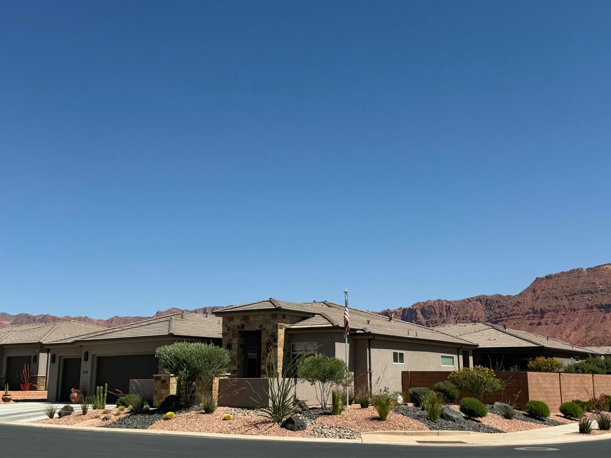 Located in the desirable Mojave Mesa subdivision in Ivins, this stunning custom home offers elevated desert living surrounded by breathtaking red rock and mountain views. Tucked away on a quiet cul-de-sac, this beautifully upgraded property combines luxury finishes, thoughtful design, and the peaceful lifestyle Southern Utah is known for -- with biking and walking trails conveniently located right out your front door. Conveniently located near dining, golf, and entertainment at Black Desert Resort, with even more exciting amenities and growth coming soon to the Ivins area.

Built in 2022, this 4-bedroom + office home features 2,311 sq ft of thoughtfully designed single-level living with an open-concept floor plan perfect for entertaining and everyday comfort. The home showcases designer window coverings, a striking iron front door, epoxy garage flooring, and professionally finished courtyard and backyard spaces that create seamless indoor-outdoor living.

The spacious kitchen and living areas are complemented by upgraded finishes throughout, while the landscaped yard and incredible surrounding views provide a true retreat-like setting. Included with the home are the washer, dryer, and refrigerator, making this property even more move-in ready. Additional items may also be negotiable.

With too many upgrades to list, this exceptional home offers a rare opportunity to own a beautifully appointed property in one of Southern Utah's most sought-after communities -- where outdoor recreation, luxury, and serenity come together beautifully in Ivins, Utah.