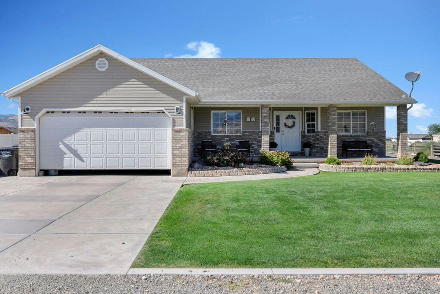 Tucked at the end of a quiet cul-de-sac, this 5-bedroom, 3-bathroom brick home in Central Valley, Utah offers space, views, and the lifestyle you've been looking for. Sitting on .93 acres with stunning mountain views, this 3,360 sq. ft. home provides privacy and room to truly enjoy. Step inside to find new carpet and an updated kitchen featuring crisp white cabinetry, creating a bright and inviting space perfect for gathering and entertaining. The layout offers both comfort and functionality, ideal for families of all sizes. The basement adds incredible versatility with a huge storage room, a dedicated salon area, and additional space perfect for a home gym. Outside, enjoy a beautifully landscaped yard featuring a pergola and a spacious deck just off the double doors-perfect for relaxing, entertaining, and taking in the surrounding views. The possibilities are endless with this property, approved for animals and horse use, making it a rare find. Enjoy your own private basketball court with lighting for evening games, plus an additional storage shed for all your tools, toys, or equipment. Located on a private street in an amazing location, this home combines peaceful country living with convenience. Whether you're looking for space, views, or lifestyle-this property truly has it all.