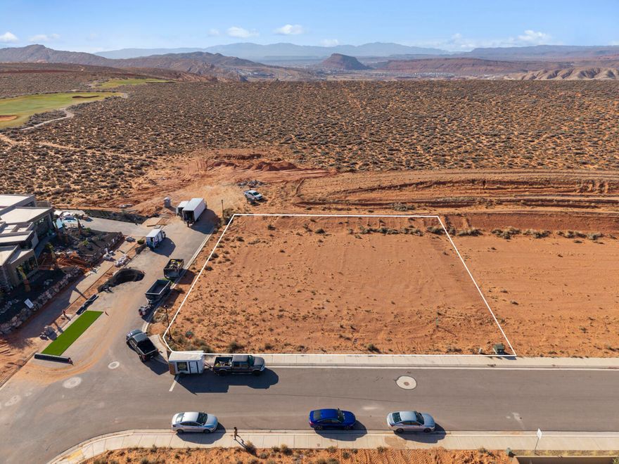 Escape the ordinary and build your dream home on this spacious .50-acre lot in The Estates at Sand Hollow Resort, a premier golf course community anchored by a nationally ranked championship course. This corner homesite offers ample room for a custom residence, expansive outdoor living, a private pool, and oversized garages for all your toys. Perfectly blending luxury with Southern Utah's adventure-driven lifestyle.
Enjoy stunning desert landscapes, close proximity to golf, and easy access to world-class recreation. Conveniently located just 15 minutes from the airport and 1.5 hours from Las Vegas, this is an ideal primary residence or luxury retreat.
Homeowners enjoy ownership benefits including front and backyard landscape maintenance for hassle-free living. Choose from a list of Premier Builders or bring your own developer-approved builder to bring your vision to life.