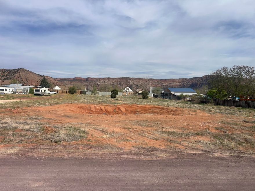 Foundation has been removed, Rare opportunity to own a flat 0.86-acre buildable lot with unobstructed red cliff views in a new and growing neighborhood. This ready-to-build lot offers natural privacy, a prime location, and easy access to utilities.  Water meter is installed, and water, sewer, and gas fees have been paid, saving buyers significant upfront costs. Most utilities are stubbed to the lot line, making this an ideal site for a custom home.  Seller is motivated and will consider any reasonable offer.