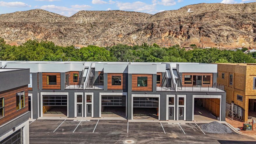 Nestled in the heart of La Verkin, these versatile flex spaces offer a unique living opportunity in one of southern Utah fastest growing areas. These modern, customizable spaces are perfect for entrepreneurs, creative & businesses seeking a dynamic environment to thrive. This is a fully finished unit with 1800 sqft of garage space and 1600 sqft on the 2nd level for home and office space. HOA is $125 a month and includes putting green, master insurance policy, water, garbage, dumpsters, security common area & parking lot maintenance. Owner/Developer is a licensed agent.