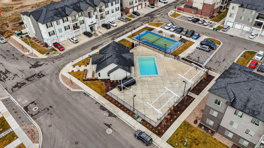 Beautifully maintained ad thoughtfully designed, this light filled condo offers a modern open concept layout with stylish finishes throughout. The kitchen showcases sleek cabinetry, stainless steel appliances and quartz countertops. The primary bedroom is generously sized with large windows that capture scenic views and natural light. Additional office/flex room off the living room offers flexibility for a home office, playroom or exercise room. Enjoy low maintenance living with the convenience of an attached garage and easy access to community amenities including a clubhouse, pool and pickleball court. Ideally located near Thanksgiving Point, shopping, dining and commuter routes. This home combines comfort, style and an exceptional location- an opportunity you don't want to miss.