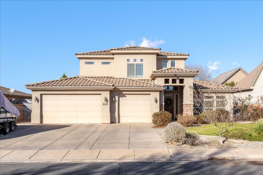 Located in the desirable Washington Fields Planned Development, this well-maintained 4 bedroom, 2.5 bathroom home offers a thoughtful layout, generous living spaces, and comfortable everyday living. The main level features an open-concept design where the kitchen, dining, and living areas flow seamlessly, creating an inviting setting for both entertaining and daily life. The kitchen is highlighted by warm wood cabinetry, ample counter space, a center island, and a walk-in pantry, while large windows and glass doors fill the space with natural light and provide direct access to the backyard.

The primary suite is conveniently located on the main level and offers a private retreat with a tray ceiling, abundant natural light, an en suite bathroom with dual vanities, a soaking tub, separate shower, and a spacious walk-in closet with custom organization. A main-level half bath adds everyday convenience.

Upstairs, a large family room provides flexible space for a second living area, media room, or home office. Three additional bedrooms are located on the upper level, each generously sized and thoughtfully laid out, including secondary bedrooms with walk-in closets. A full bathroom serves the upstairs bedrooms with ease.

Outside, the fully fenced backyard features a covered patio and open lawn area, perfect for relaxing or entertaining. A three-car garage provides excellent storage and parking. Situated in an established neighborhood with nearby parks, trails, and convenient access to schools, shopping, and recreation, this home offers comfort, space, and a prime Washington Fields location.