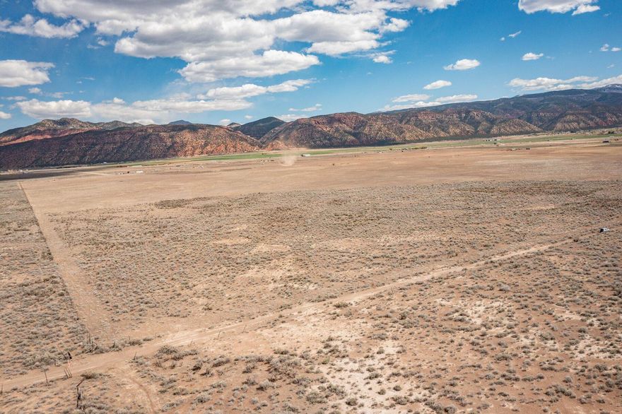 Remarkable opportunity to own a 20-acre parcel just off exit 82 on i-15 for Paragonah. With stunning mountain views and ready for you to build your perfect oasis. Zoned as A-20. Each lot comes with 1 acre-feet of water right. Parowan is an incredibly beautiful small town of just over 3,000 residents. Close to Cedar City, which is home to Southern Utah University, and the Shakespeare Festival, as well as some amazing restaurants. As part of Southern Utah, you will experience a lifestyle like no other. The area features nearby internationally recognized mountain biking trails, road cycling, hiking, golf courses, national parks such as the Grand Canyon, Zion, & Bryce, plus national moments, national forest, reservoirs, & some of the most iconic desert landscape in the world. Less than 30 minutes from Brian Head Ski Resort, there is no doubt that this is a fun place to live and play.  

All information herein is deemed reliable but is not guaranteed. Buyer is responsible to verify all listing information, including square feet/acreage, to buyer's own satisfaction.