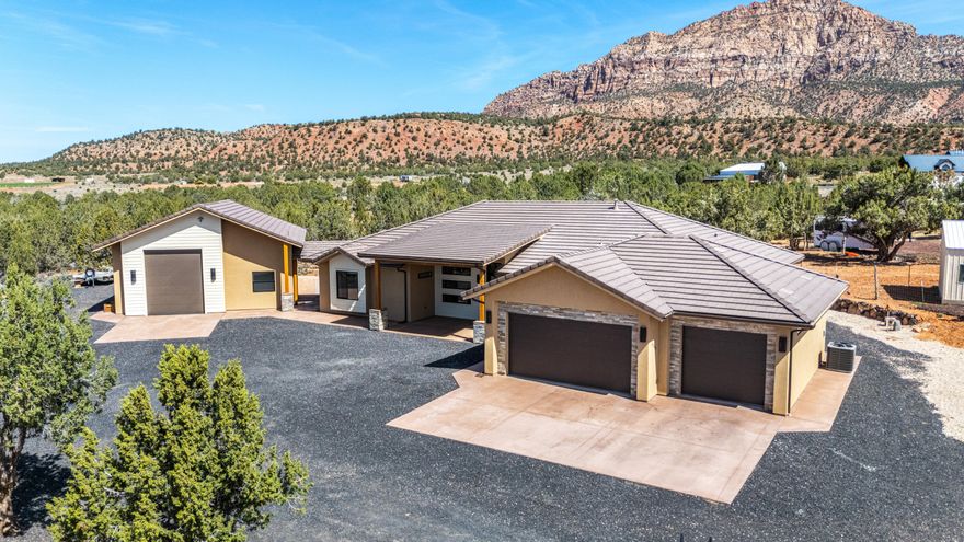 Like-new 3,005 sqft home in Apple Valley offering space, privacy, and some of the best views Southern Utah has to offer. Set right beneath Mt. Canaan, this property delivers wide open desert scenery, incredible sunsets, and clear, star-filled nights you just don't get in town. Located in a dark sky community, you'll experience unmatched night skies and peaceful surroundings. Apple Valley is known for its quiet lifestyle, larger lots, and easy access to Zion National Park, making it ideal for those wanting space without being too far from St. George or Hurricane.

This horse property is fully set up with room to expand and use how you want. It includes a large shop with RV-height clearance, plus three separate RV hookups, making it perfect for storing toys, hosting guests, or creating additional income opportunities. The property also features a detached casita, along with an additional detached insulated building equipped with full electric, heat, and AC, ideal for a home office, bunkhouse, playroom, or extra storage.

Inside, the home is clean, modern, and well thought out with exposed wooden trusses, vaulted ceilings, custom walnut cabinetry, re-circulation pumps, a well above standard water filtering system, and a water softener. The insulated garage and garage doors add an extra level of comfort year-round. The layout offers both comfort and functionality, whether you're living full-time, using it as a second home, or maximizing it as an income-producing property.

If you're looking for something that offers land, flexibility, views, income potential, and a true Southern Utah lifestyle, this one checks all the boxes.