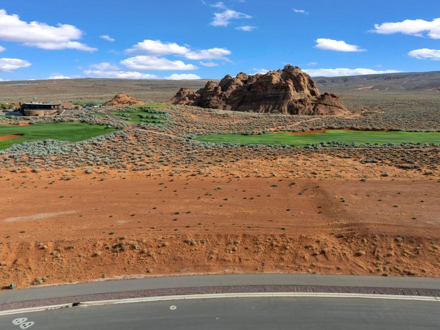 .78 Acre Luxury Lot | The Estates at Sand Hollow Resort
Positioned on the 10th fairway of Sand Hollow's Championship Course, this rare .78-acre homesite in The Estates offers the perfect blend of privacy, scenery, and lifestyle. The property enjoys unobstructed northern views of Pine Valley and beautiful southern red rock & the golf course, creating an unmatched backdrop for your future home. Surrounded by multi-million-dollar residences, this is one of Southern Utah's most exclusive communities. Just minutes from Sand Hollow State Park and sand dunes, the location provides easy access to both luxury and adventure. When you build at The Estates, you gain more than a homesite, you gain a community. Offering access to championship golf, resort amenities, and the endless adventure lifestyle Southern Utah is known for. You will have access to the list of premier builders, each known for superior craftsmanship, design, and a streamlined process that ensures your home harmonizes with the desert landscape while reflecting your unique style. If you prefer, you may also bring your own approved builder to bring your vision to life.
With championship golf, world-class recreation, and the serenity of open views, this property is more than an investmentit's the foundation for your private oasis and a lifestyle that defines Southern Utah luxury living.