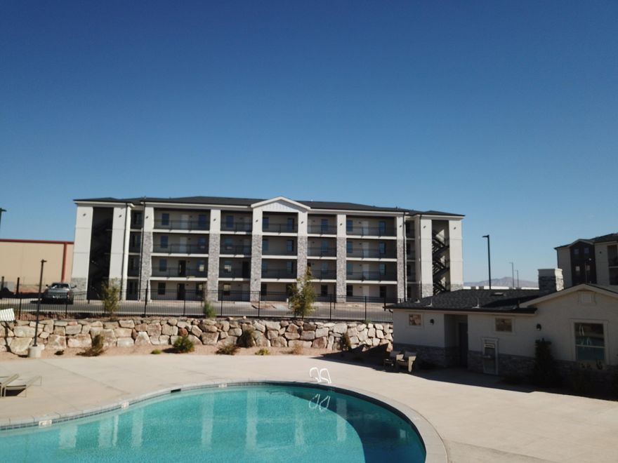 Brand new MAIN FLOOR condo across from the pickleball courts and pool.  Phenomenal opportunity for FHA loan, Conventional loan, or Utah Housing's new $20000 first time homebuyer program.  Upgraded carpet, counters, and appliances.