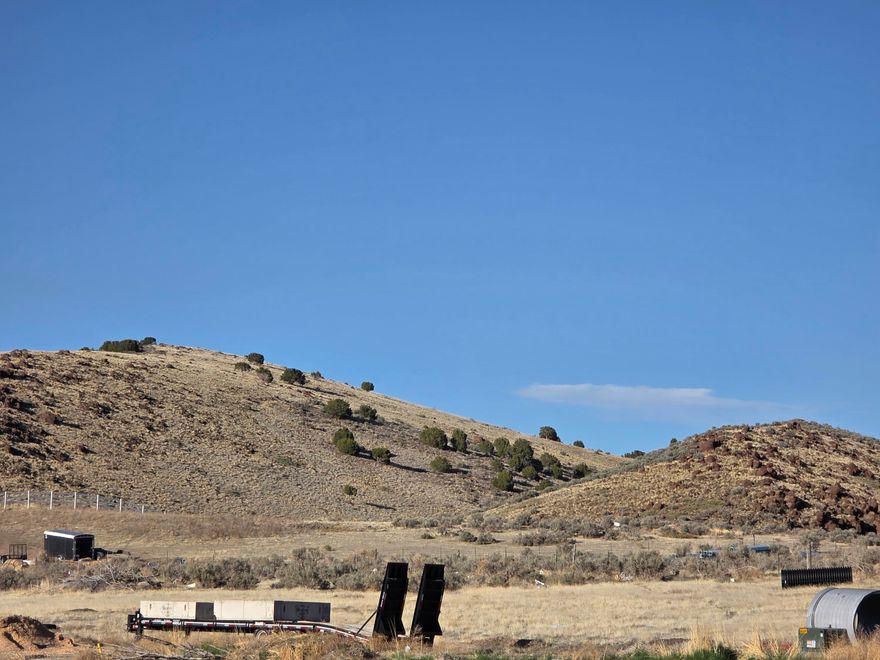 Incredible view lot in Enoch, paved roads, curb and gutter, No HOA, all utilities stubbed on to lot, water right included and deeded to Enoch City. Last lot available in Spring Hill Subdivision.