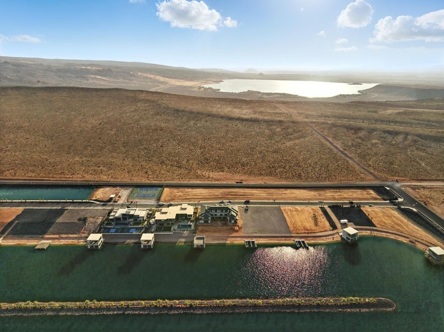 Imagine waking up to breathtaking sunrises over the vast expanse of the high desert. Your luxury lot, nestled within a prestigious gated community, offers unparalleled views and endless possibilities. Enjoy the beauty as well as the fun in this community's private lake surrounded by gorgeous palm trees. While you are always welcome at the community lake, you are also within minutes of Sand Hollow Reservoir, as well as the sand dunes at Sand Hollow State Park. Stay active on the world-class pickleball courts, or hit the links at Copper Rock Golf course just a few minutes away. Experience the thrill of surfing in the desert at the community surf lake, where you can ride the waves and enjoy the sun-kissed landscape. Another fun feature of this development is the cable lake for riders of all levels. This extraordinary community combines luxury, recreation, and natural splendor, making it the ultimate desert retreat.