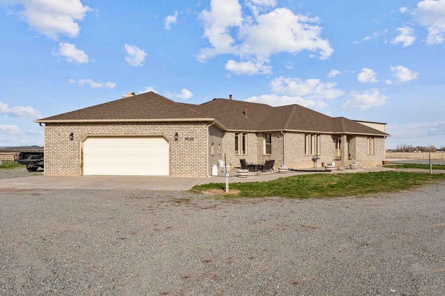 Welcome to this charming home nestled on 22 acres of picturesque land, exuding timeless character. The house features large windows that allow natural light to fill the rooms, offering serene views of the sprawling landscape and a mature orchard. The kitchen comes with a perfect walk-in pantry, spacious living areas, and a master suite that feels like a retreat, this home has plenty of space to relax. The vast land offers room for a mini ranch or gardening, while a large shop provides space for hobbies or storage. A perfect blend of nostalgia and potential. Come fall in love today!