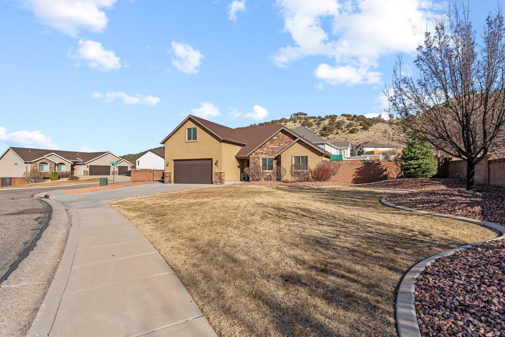 Charming single-level, handicap-accessible home with a bonus room, offering 4 bedrooms and 3 bathrooms. The open living room and kitchen create a spacious and inviting layout, perfect for gathering. This lovely property also features vaulted ceilings, a fully fenced yard, and large RV storage on the side. Located in the desirable Sunset Canyon subdivision, it offers a peaceful setting while remaining close to Cedar City. Don't miss the chance to see this delightful home—schedule your showing today!