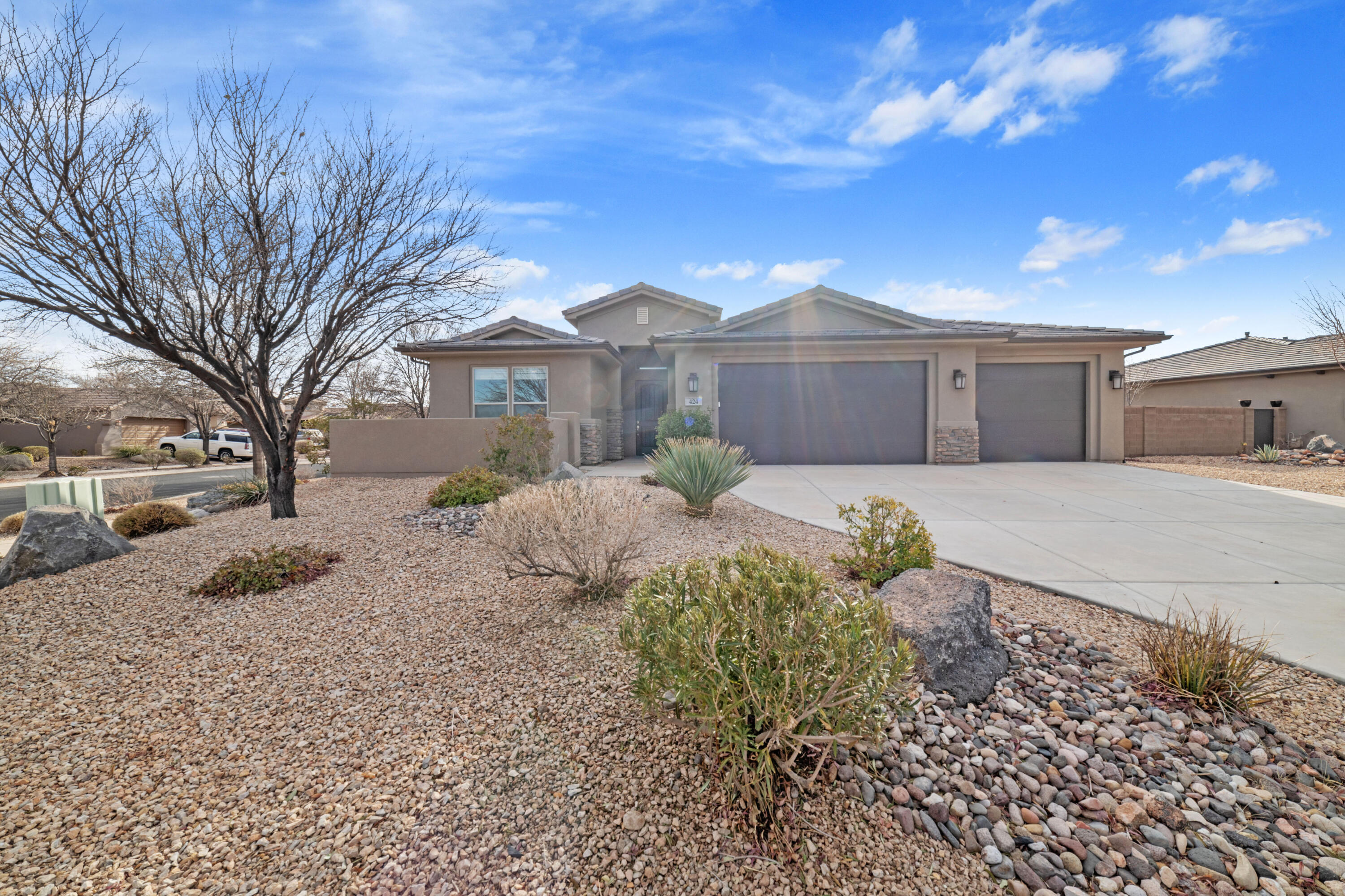 Welcome home! Located on top of the ridge at Coral Canyon! This property boasts modern design, spacious living areas, offering the perfect combination of comfort and elegance.

Come inside to find a bright, open-concept layout with high ceilings and large windows that flood the home with natural light. The kitchen is a chef's delight, featuring granite countertops, stainless steel appliances, and ample storage space. Perfect for entertaining, the kitchen flows seamlessly into the dining and living areas.

The luxurious primary suite is a true retreat, complete with a walk-in closet and a spa-like en-suite bathroom featuring dual vanities, a soaking tub, and a walk-in shower. Additional bedrooms provide plenty of space for guests. Meander outside to your beautifully landscaped backyard. Enjoy the covered patio for dining or unwind while taking in the surrounding area. The 3 car garage make this home as practical as it is beautiful.

Located in a quiet and friendly neighborhood, offers easy access to nearby parks, schools, shopping, and dining, as well as Washington's famous outdoor recreation opportunities.

Don't miss the chance to make this exceptional property your new home. Schedule a showing today and experience the best of Southern Utah living!