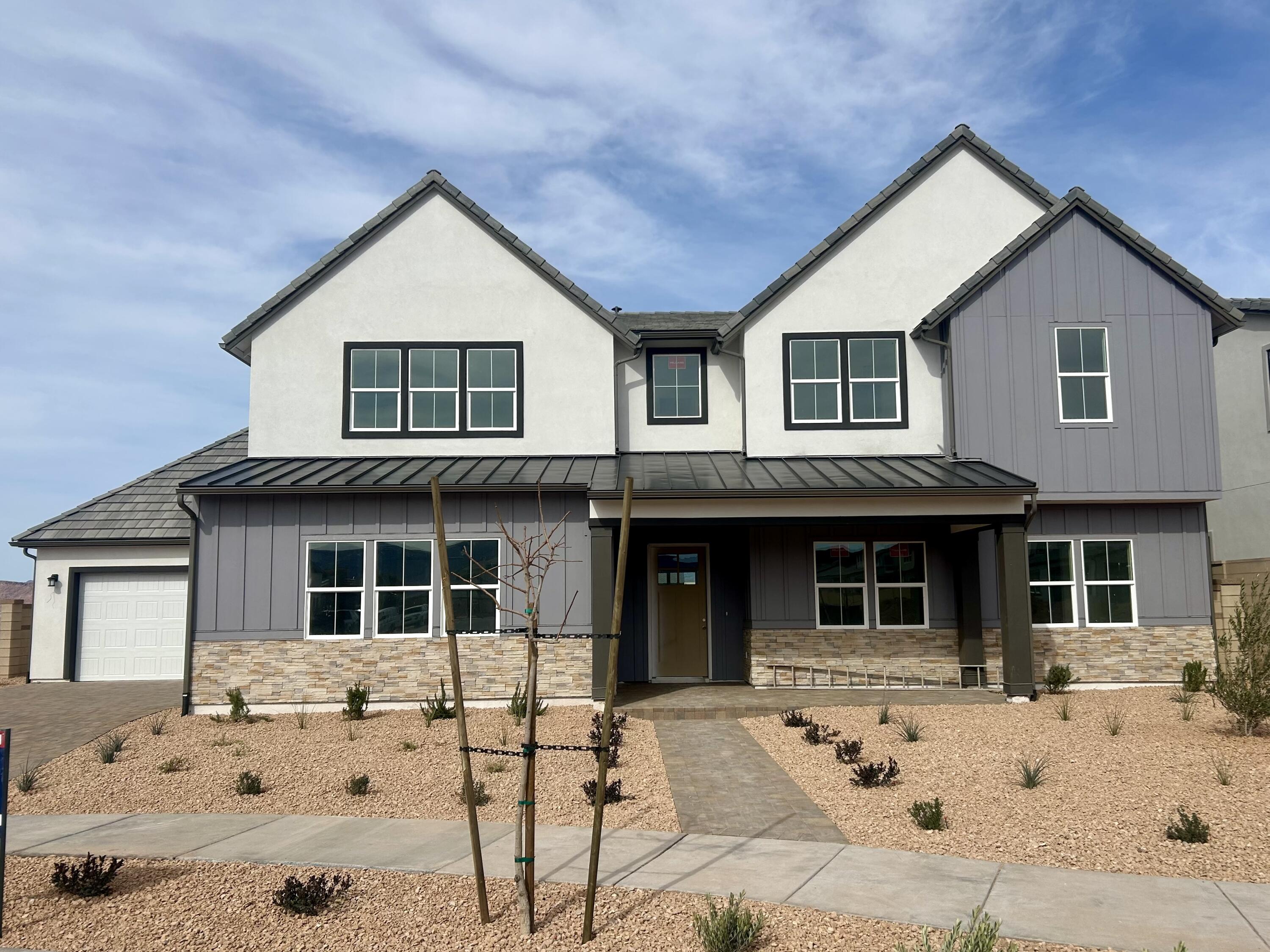 The Meseta plan has 10' ceilings throughout plus vaulted 20' ceilings at entry and great room! 40' covered rear patio & 20' covered front porch, fully fenced rear yard. Gourmet kitchen with stainless steel appliances, walk-in pantry, large center island, main floor guest bed with en-suite bath, retreat-like primary suite w/oversized freestanding tub, lux walk-in shower & large dual closets, pavers on all walks/driveway, drip Irrigation, two separate 2-car attached garages with private driveway. Tankless H20 heater, 2x6 construction, new & warranted! All in a community offering a 2.5-acre lagoon, pool, spa, internet, pickleball and bike paths. Visit agent at the model home, open 7 days a week 10-5.