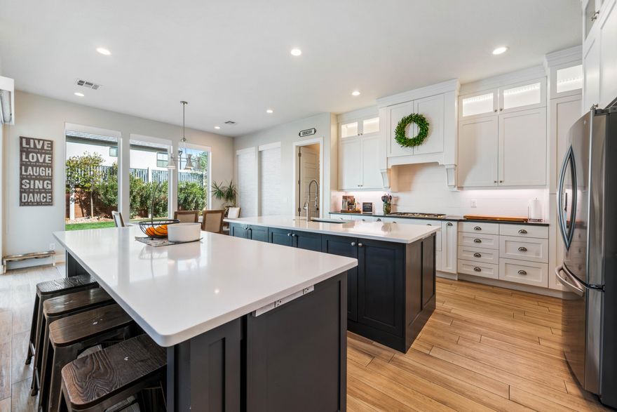 Welcome to this beautifully maintained home nestled in a quiet cul-de-sac, offering stunning curb appeal and meticulously manicured landscaping. Step inside to a bright, open-concept layout featuring soaring ceilings and abundant natural light, creating a warm and inviting atmosphere. The spacious kitchen is a true centerpiece, showcasing two large islands, generous cabinetry, and modern appliances--perfect for both everyday living and entertaining.

A unique highlight of the home is the dedicated in-home salon, ideal for a home-based business, creative studio, or flexible bonus space. Thoughtfully designed living areas, comfortably sized bedrooms, and a private backyard create the perfect blend of comfort and functionality. Step outside to your own backyard oasis featuring a refreshing pool--perfect for relaxing, entertaining, and enjoying warm days.

Additional features include RV parking, a 2-car garage, and an oversized third-car garage that can accommodate two vehicles, complete with a built-in batting cage. Conveniently located near top-rated schools, parks, shopping, and dining, this home truly has it all.