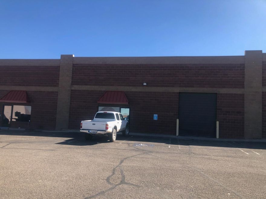 Open warehouse space that is 2650 square feet inside. It is a wide open and has a finished bathroom. There is an over head door and a man door. Block building great central location.