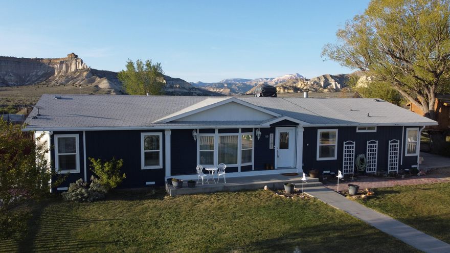 Located in the quiet, welcoming community of Henrieville, this beautifully maintained 3-bedroom, 2.5-bath home offers comfort, space, and unforgettable scenery in the heart of Southern Utah. The home features both a spacious living room and a separate family room, along with a formal dining area perfect for gatherings and entertaining. Durable LVP flooring runs throughout, creating a clean, cohesive look that complements the home's thoughtful layout. Outside, the oversized back porch is a true highlight, providing sweeping views of the surrounding mountains and wide-open skies--an ideal setting for morning coffee or relaxing evenings. While you're out back, enjoy the cozy firepit under the stars and the putting green for sharpening your short game. The exterior's royal blue color stands out beautifully against the lush green grass, creating picture-perfect curb appeal. Situated in a charming small-town, its just over 15 minutes from Bryce Canyon National Park. This property offers peaceful rural living with world-class recreation just minutes away.