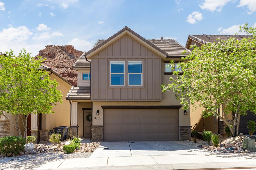 Welcome to stunning red rock mesa views from this charming Desert Canyons gem. This detached townhome combines single-family privacy with the low-maintenance ease and smart, efficient layout of a townhome in a prime St. George location.

Carefully maintained with pride and kept very clean, this move-in-ready home features a bright, open-concept main level with seamless flow between the living, dining, and kitchen areas. The spotless kitchen showcases rich dark alder stacked cabinetry, a crisp white subway tile backsplash, solid granite countertops, stainless steel appliances, and a generous walk-in pantry.

Upstairs, a French door entrance welcomes you into the spacious master suite, complete with a large walk-in closet and dual-sink vanity. The thoughtful second-story layout provides three additional generously sized bedrooms, another full bathroom, and convenient laundry room.

Sunsets painting the mesa create a daily awe-inspiring backdrop, enjoyed from inside the home or the privately fenced backyard with lush artificial turf. Just over the fence sits Broken Mesa Park, offering a playground, covered pavilion, walking paths, and trails. Hitting the sweet spot on location, this home is surrounded by incredible desert landscape, yet minutes from the airport, excellent schools, mountain biking/hiking trails, plus new and upcoming restaurants and entertainment.

Ideal for new homebuyers and investors alike, this home offers strong rental and cash-flow potential. Priced to sell quickly, this well-cared-for detached townhome is an outstanding opportunity you won't want to pass up.