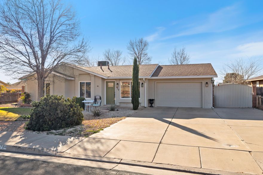 This beautifully remodeled home, showcasing breathtaking views of Red Mountain, is truly move-in ready. From the vaulted ceilings and abundant natural light to the expansive backyard with mature trees and a serene, private atmosphere, this property is a peaceful Ivins sanctuary. Thoughtful upgrades throughout include fresh interior and exterior paint, a completely redesigned kitchen featuring stunning hickory cabinetry and custom salmon wood countertops, new kitchen appliances, brand new washer and dryer, and a new water heater. Additional improvements include new windows, a new sliding glass door from the primary suite to the outdoor patio, a new front door, luxury vinyl plank flooring throughout, and all new lighting. The bathrooms have been fully remodeled with carefully selected tile and an elegant glass shower.Perfectly situated near Snow  Canyon, Tuacahn Center for the Arts, charming restaurants, and within walking distance to the grocery store, this exceptional home blends comfort, style, and convenience. A true gem. Experience it for yourself.