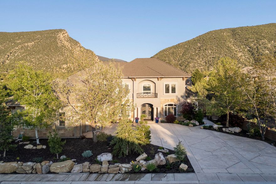 Tucked away at the end of a quiet road in the desirable Ashdown Forest community, lies this architectural marvel of a home. The Mediterranean Revival style home with a Tuscan influence has been thoughtfully designed to offer sweeping mountain views of Fiddlers Canyon and a peaceful setting to match. From the moment you arrive, you'll notice the impressive curb appeal, iron front door, and welcoming entry that opens into a light-filled foyer with cathedral ceilings and panoramic windows that bring in sunshine all day. Inside, the home features high ceilings, hardwood floors, shiplap accents, fireplace, stackable large patio doors, neutral three-tone paint, and granite countertops throughout. The open-concept layout includes spacious rooms, a beautifully finished kitchen, and a magnificent primary suite designed for comfort and privacy. The oversized 3-car garage includes 24-solar panels (10 Kw) with a battery wall, and there's even an RV pad for your extra toys. Additional features include a primary suite with sauna, 100 gallon water heater, RO and entire home water filtration system, whole house light automation, and so much more. The side yard offers plenty of room to create your dream outdoor space: whether it's a pool, pickleball court, or another fun-filled area for family gatherings. With well-manicured landscaping and space to entertain, this home offers a rare mix of style, comfort, and opportunity in one of Cedar City's most scenic neighborhoods. This is a must-see for anyone looking to enjoy mountain views, open living, and space to grow.

Cedar City is one of the most beautiful cities. It is home to Southern Utah University and the Shakespeare Festival, as well as some amazing restaurants. As part of Southern Utah, you will experience a lifestyle like no other. The area features nearby internationally recognized mountain biking trails, road cycling, hiking, golf courses, national parks such as the Grand Canyon, Zion, & Bryce, national moments, national forest, reservoirs, & some of the most iconic desert landscapes in the world. Less than an hour away from Brian Head Ski Resort, there is no doubt that this is a fun place to live and play.

All information herein is deemed reliable but is not guaranteed. Buyer is responsible to verify all listing information, including square feet/acreage, to the buyer's own satisfaction.