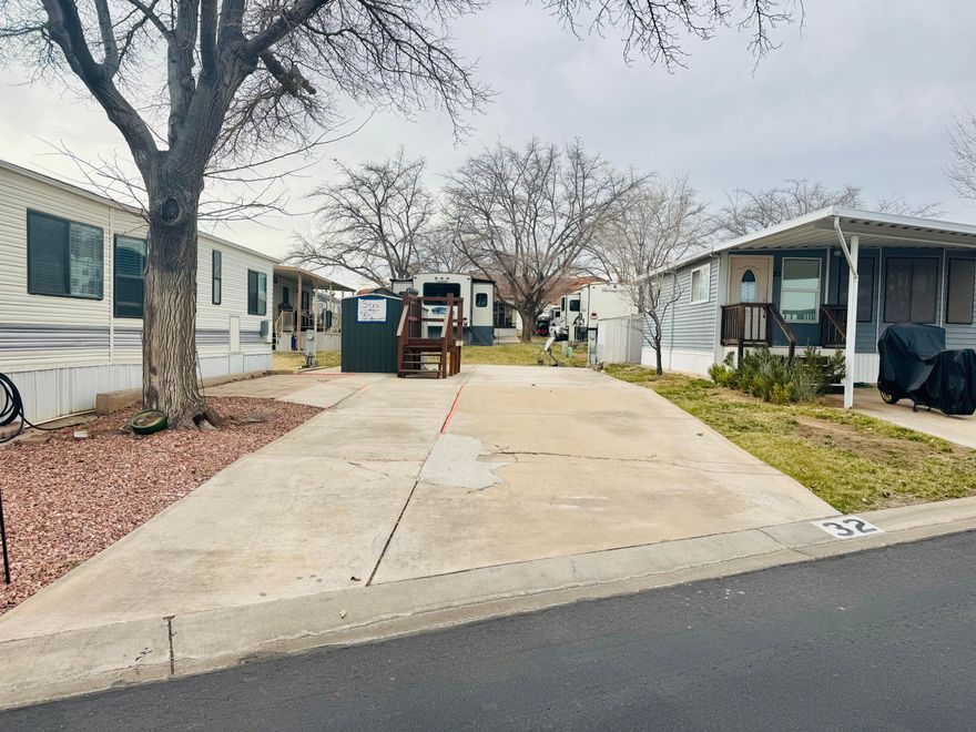 Nestled among the red mountains of Southern Utah, this shaded lot offers a peaceful setting within a desirable 55+ community. The property includes one large shed and is ideally located near shopping, golfing, medical facilities, and scenic walking paths—perfect for enjoying the best of Southern Utah living. Buyer to verify all information.