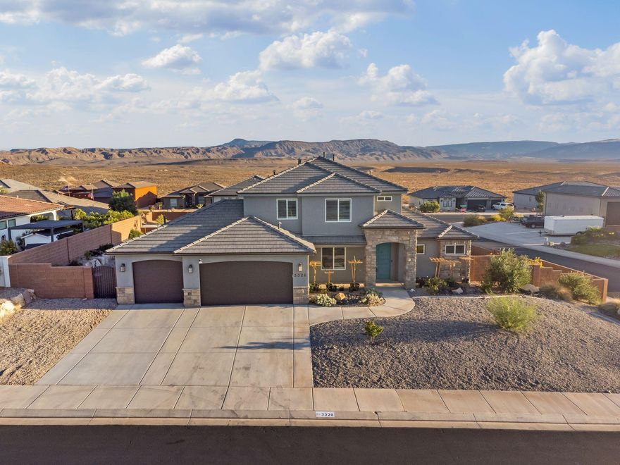 Welcome home to Desert Canyons community! This stunning 5-bedroom Desert Heights custom home offers luxury, function, & location! No HOA, affordable Dixie Power utilities + Water Conservation Rebate Program. Main-level primary suite is complemented by a second primary suite upstairs, while open living area features wood-look tile & a cozy fireplace. Gourmet kitchen boasts painted cabinetry, quartz countertops, stainless gas appliances & walk-in pantry. Spacious bonus room upstairs for a theater, gym, or game room with incredible views of Arizona skies. Enjoy a fully enclosed yard with turf, patios & garden areas, with possible space on the side yard to park an RV Access to hiking, biking, ATV trails, nearby reservoirs, endless outdoor recreation & nearby schools, this home blends luxury, function & the best of Southern Utah living!