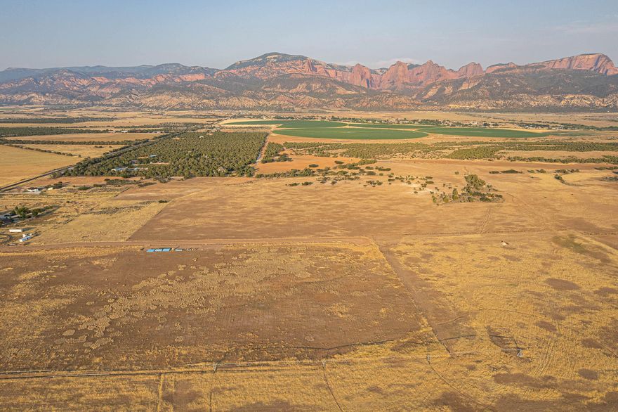 Tucked into one of Southern Utah's most stunning valleys, this rare 6-lot subdivision offers spacious parcels ranging from 5 to 6 acres each—perfectly positioned to take in breathtaking views of both Kolob Canyon and Pine Valley Mountain. Whether you're looking to build your dream home or invest in a piece of this peaceful paradise, these lots offer the perfect blend of space, beauty, and convenience.
Each lot is gently nestled into the landscape, offering a serene, private feel while still being part of a thoughtfully designed neighborhood. The setting is truly one-of-a-kind—surrounded by wide-open skies, incredible sunsets, and mountain backdrops in every direction.
Utilities are already in the street, making your build process easier and more affordable. Taxes to be determined
