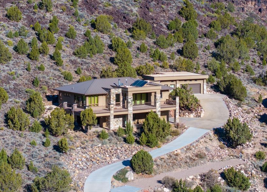 So many ADU possibilities! Amazing luxury home on unique lot. Multi generation or rental options for basement apartment/casita, studio/office/extra bedroom, RV parking. Custom built ICF construction with with so many luxury upgrades. Abundant cabinets and storage in the home and garage. Main level has a large kitchen and great room, primary suite must be seen in person, all with access to a wrap around deck with built in BBQ. Views included! Lower level has a walk out casita with everything including its own garage and W/D hookups. Hot tub pad wire for 220. Adventure is just out side your door with trails and reservoirs all near by.