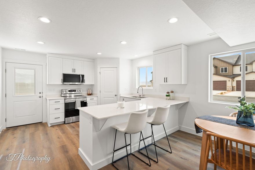 Amazing interior-unit townhome by Desert Sage Homebuilders. Here you'll find incredible value at an accessible price point. Enjoy a functional, open floor plan, with a lovely kitchen with painted/stained cabinets, quartz countertops, nice corner pantry, open great room, laundry room, and a powder bathroom on the main level. Upstairs you'll find 2 bedrooms and the home's primary suite. The Cedar Breaks community is located in a great area with quick and easy access to I-15. This home would be a great primary residence or investment property! This unit does NOT have a garage, but does have a carport. *All information is deemed reliable but not guaranteed, buyer to verify all..*Photos of similar unit